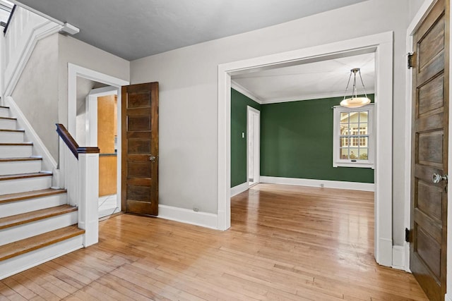 928 Emilie St, Green Bay, WI 54301 - unfurnished room with hardwood / wood-style flooring, stairs, and crown molding