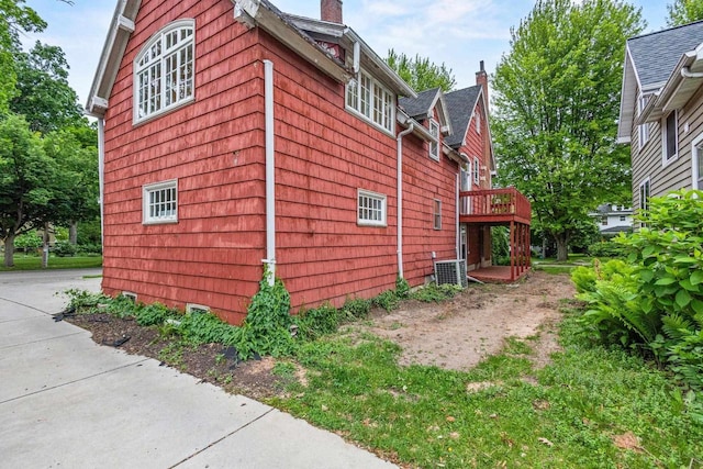 928 Emilie St, Green Bay, WI 54301 - view of side of home with a chimney and a wooden deck