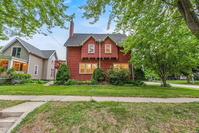 928 Emilie St, Green Bay, WI 54301 - view of front of property with a chimney and a front lawn