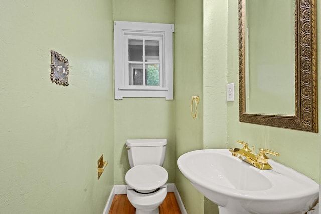 928 Emilie St, Green Bay, WI 54301 - half bath featuring a sink and wood finished floors