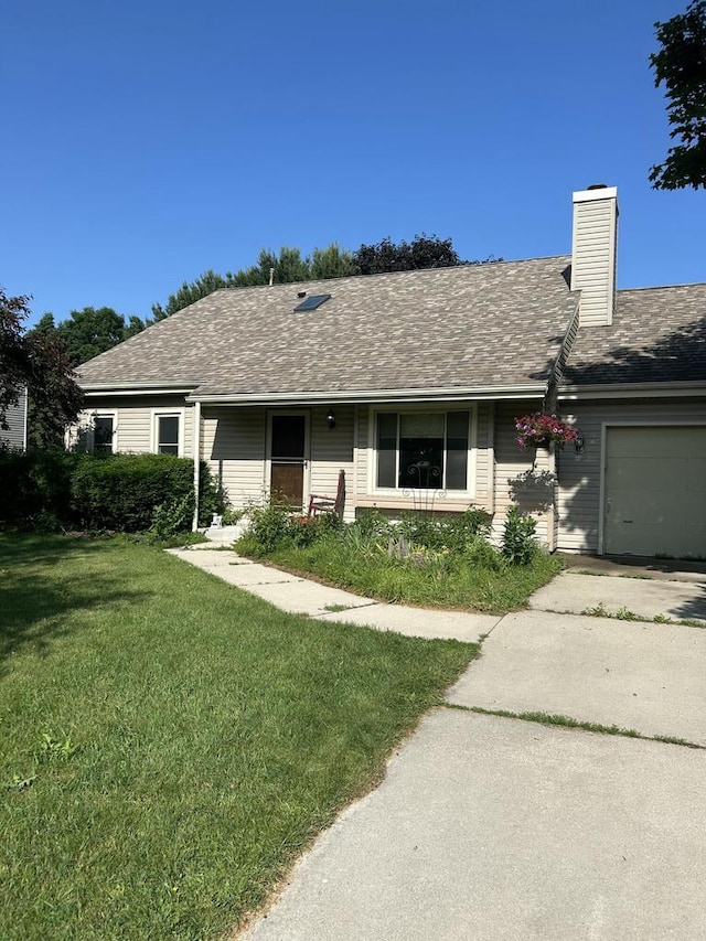 3987 Elaines Way, Slinger, WI 53086 - ranch-style house with a front yard, an attached garage, a chimney, and concrete driveway