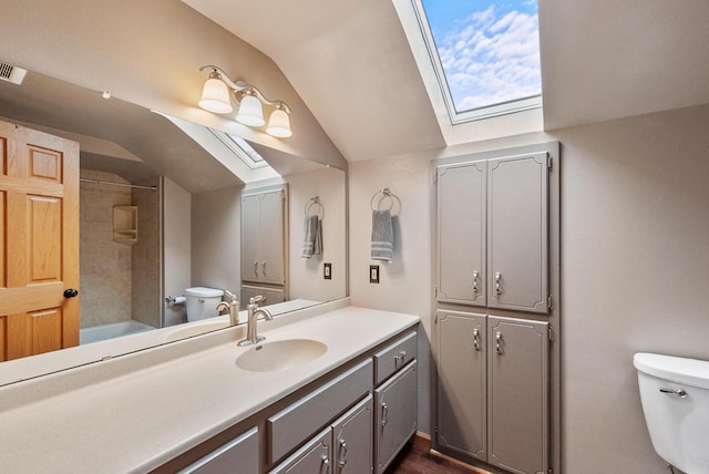 3987 Elaines Way, Slinger, WI 53086 - bathroom featuring a skylight, vaulted ceiling, vanity, and shower / washtub combination