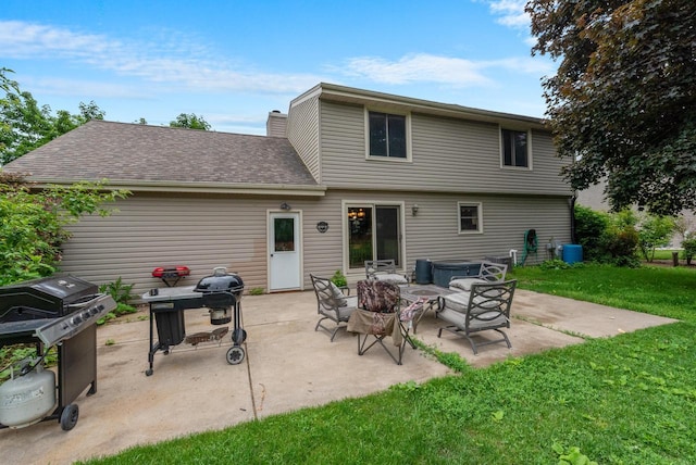 3987 Elaines Way, Slinger, WI 53086 - back of house with a patio, a yard, a shingled roof, and an outdoor fire pit