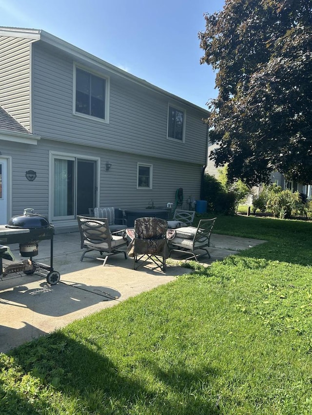 3987 Elaines Way, Slinger, WI 53086 - back of house with a patio area, a yard, and an outdoor living space