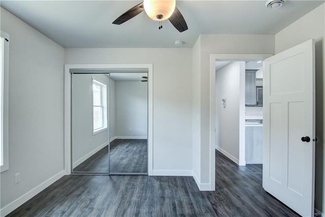 1688 Dorret Rd, Eau Claire, WI 54703 - unfurnished bedroom featuring dark wood finished floors, a closet, and a ceiling fan