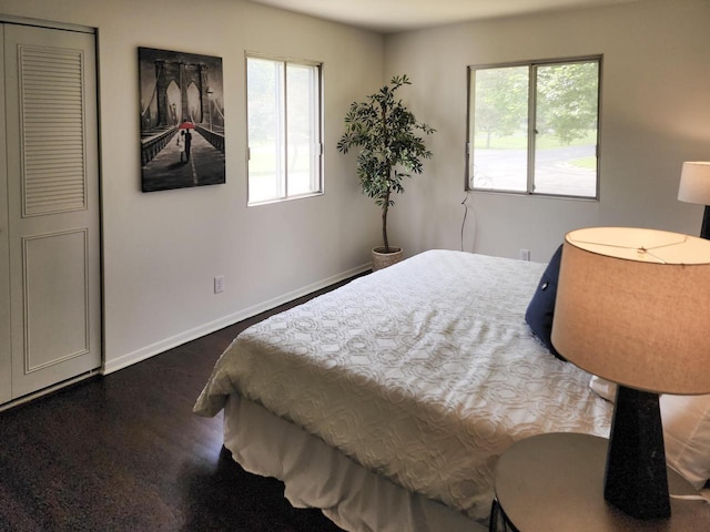 1239 Erick St, Fort Atkinson, WI 53538 - bedroom with dark wood finished floors and baseboards
