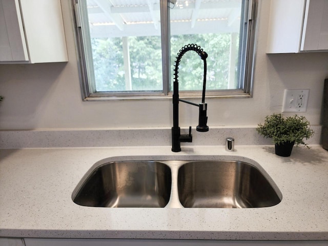 1239 Erick St, Fort Atkinson, WI 53538 - kitchen view of white cabinets and light stone counters