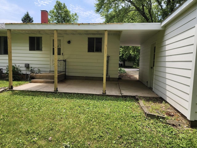 1239 Erick St, Fort Atkinson, WI 53538 - back of property featuring a lawn and a chimney