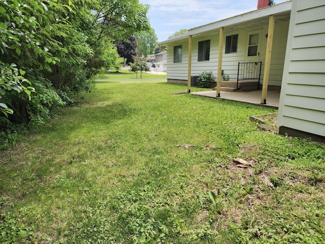 1239 Erick St, Fort Atkinson, WI 53538 - view of grassy yard with a patio area