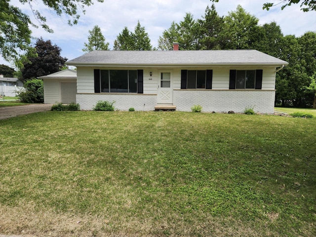 1239 Erick St, Fort Atkinson, WI 53538 - ranch-style home featuring brick siding, a front lawn, a chimney, a garage, and entry steps