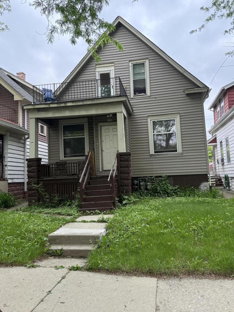 3363 N 26th St, Milwaukee, WI 53206 - view of front of home with a balcony and a porch