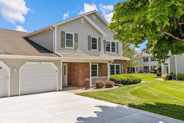 2524 Village Ln Unit B, Oshkosh, WI 54904 - traditional home with concrete driveway, an attached garage, a front lawn, brick siding, and roof with shingles