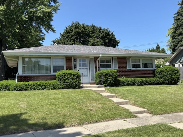 9035 W Burdick Ave, Milwaukee, WI 53227 - view of front of house with brick siding and a front lawn