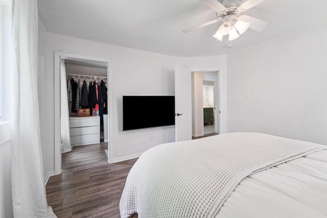 266 E 10th St, Fond Du Lac, WI 54935 - bedroom with wood finished floors, a spacious closet, a closet, and ceiling fan