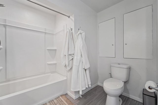266 E 10th St, Fond Du Lac, WI 54935 - bathroom featuring shower / bathtub combination and wood finish floors