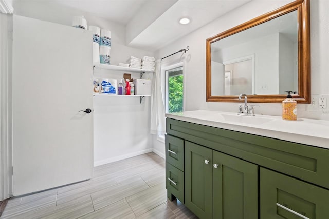 266 E 10th St, Fond Du Lac, WI 54935 - bathroom with vanity and wood tiled floors