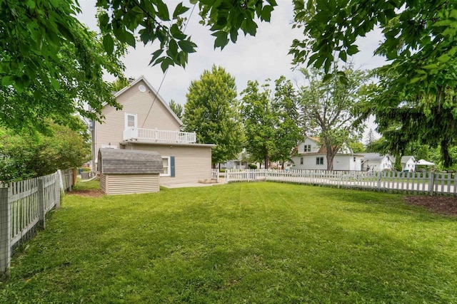 266 E 10th St, Fond Du Lac, WI 54935 - fenced backyard featuring a storage unit