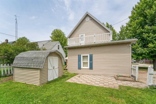 266 E 10th St, Fond Du Lac, WI 54935 - back of house featuring a balcony, a shed, and a patio area