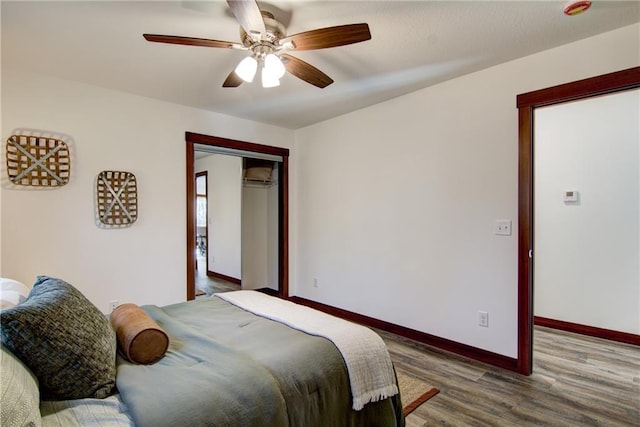 1724 Dorret Rd, Eau Claire, WI 54703 - bedroom featuring wood finished floors, a ceiling fan, and a closet