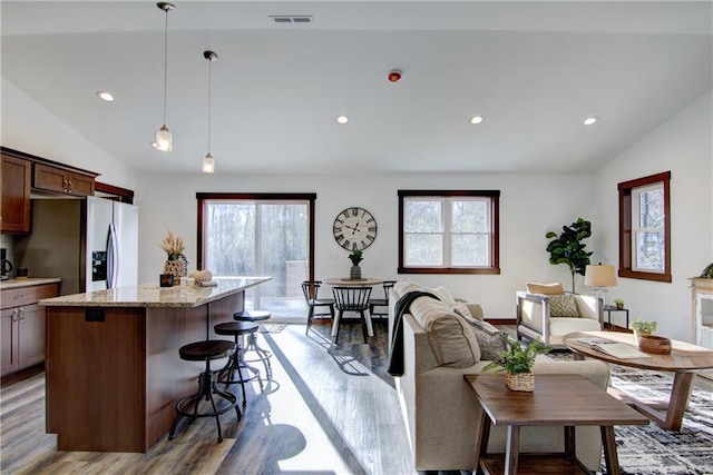 1724 Dorret Rd, Eau Claire, WI 54703 - living room featuring wood finished floors, lofted ceiling, and recessed lighting