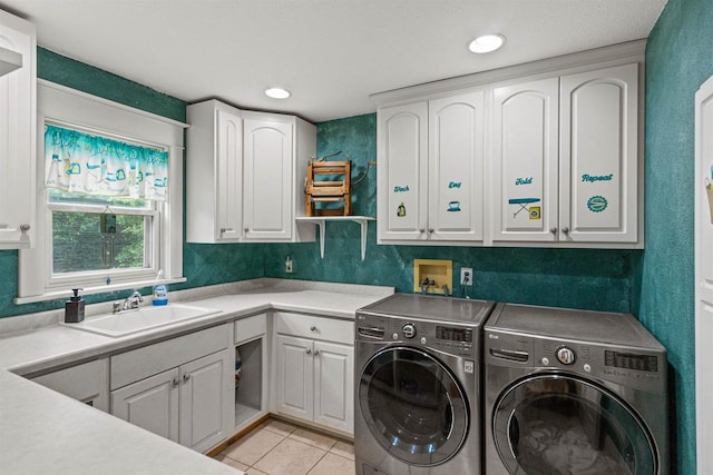 704 Sandy Pines Ct, Redgranite, WI 54970 - laundry area featuring cabinet space, separate washer and dryer, light tile patterned floors, and recessed lighting