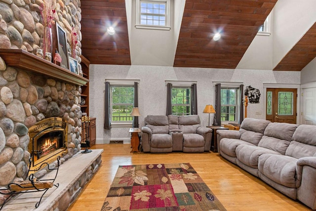 704 Sandy Pines Ct, Redgranite, WI 54970 - living room with high vaulted ceiling, plenty of natural light, a fireplace, wood finished floors, and wood ceiling