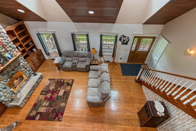 704 Sandy Pines Ct, Redgranite, WI 54970 - living area with vaulted ceiling, wood finished floors, wooden ceiling, and wallpapered walls