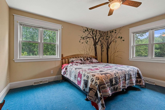 704 Sandy Pines Ct, Redgranite, WI 54970 - carpeted bedroom with multiple windows and ceiling fan