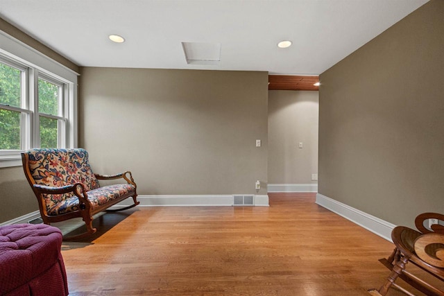 704 Sandy Pines Ct, Redgranite, WI 54970 - sitting room featuring light wood-style flooring, recessed lighting, and attic access