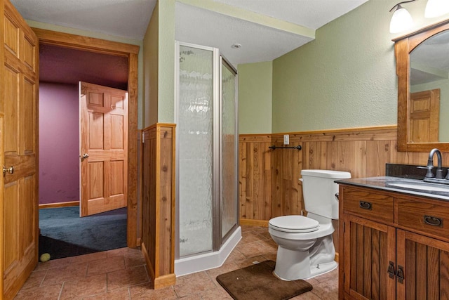 704 Sandy Pines Ct, Redgranite, WI 54970 - full bath featuring vanity, a stall shower, a wainscoted wall, and wooden walls