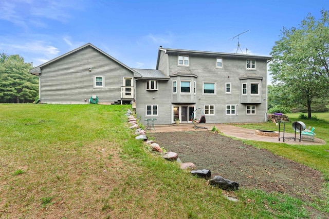 704 Sandy Pines Ct, Redgranite, WI 54970 - back of house with a patio area, a lawn, and a fire pit