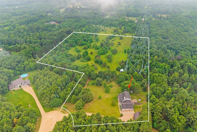 704 Sandy Pines Ct, Redgranite, WI 54970 - aerial view of property and surrounding area with property boundaries highlighted and a heavily wooded area