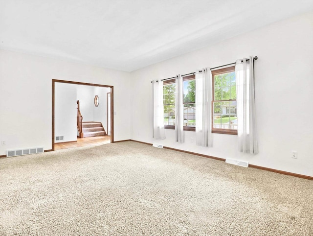 4315 Tanglewood Dr, Janesville, WI 53546 - carpeted spare room featuring stairs and baseboards