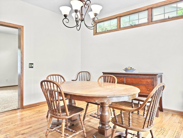 4315 Tanglewood Dr, Janesville, WI 53546 - dining area featuring a chandelier and light wood-style floors