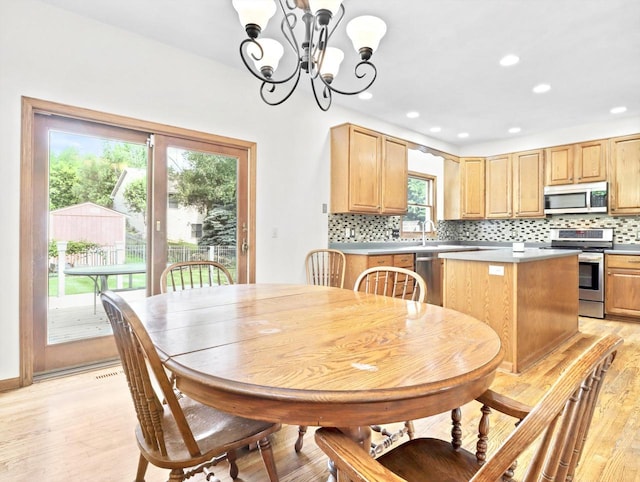 4315 Tanglewood Dr, Janesville, WI 53546 - dining area featuring light wood finished floors, a chandelier, and recessed lighting