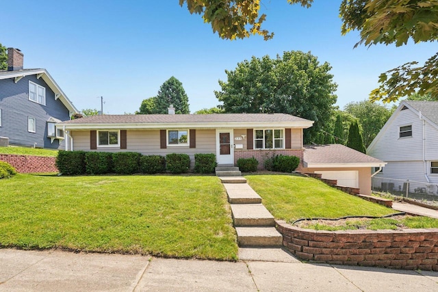 235 Jasper Ln, Waukesha, WI 53188 - view of front of home with a garage and brick siding
