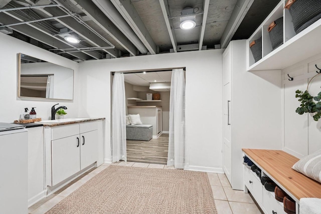 235 Jasper Ln, Waukesha, WI 53188 - mudroom with light tile patterned floors and washer and clothes dryer