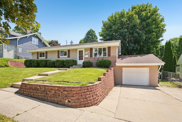 235 Jasper Ln, Waukesha, WI 53188 - view of front facade featuring driveway, an attached garage, and brick siding