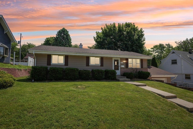 235 Jasper Ln, Waukesha, WI 53188 - ranch-style home with a front lawn and a chimney