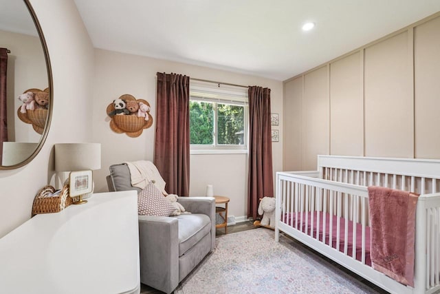 235 Jasper Ln, Waukesha, WI 53188 - bedroom featuring a nursery area, recessed lighting, and wood finished floors