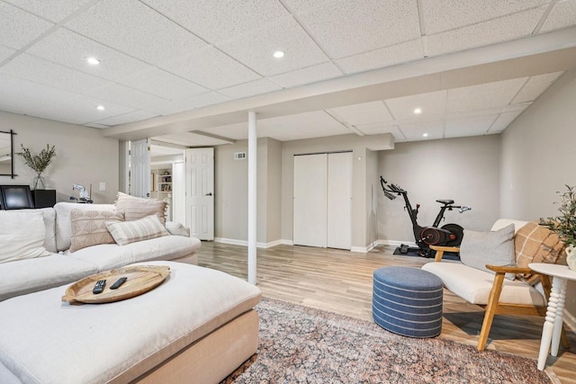 235 Jasper Ln, Waukesha, WI 53188 - living area featuring light wood-style floors, recessed lighting, and a drop ceiling