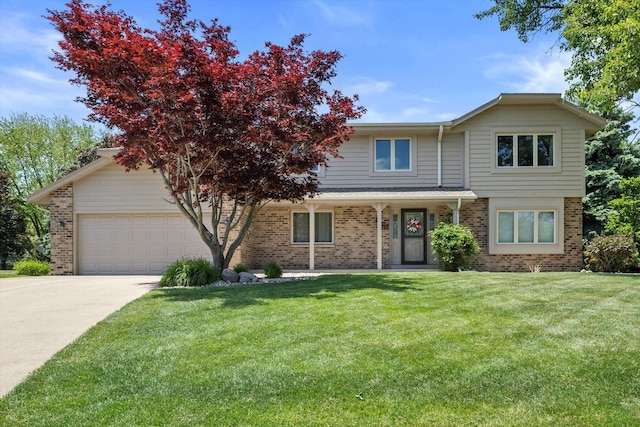 8206 41st Ave, Kenosha, WI 53142 - traditional-style house featuring brick siding, a garage, and a front lawn