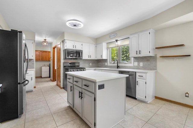 8206 41st Ave, Kenosha, WI 53142 - kitchen with appliances with stainless steel finishes, backsplash, light countertops, and white cabinetry