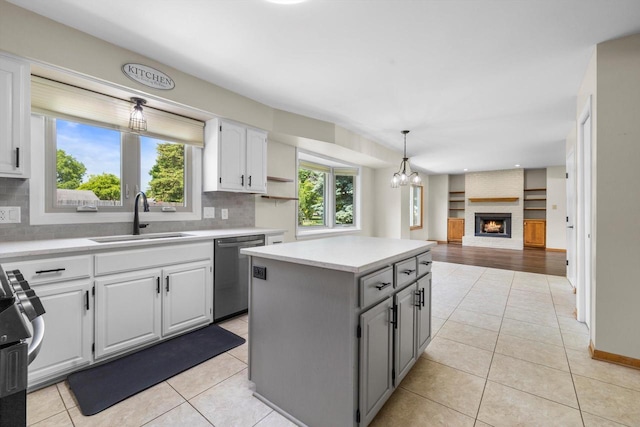 8206 41st Ave, Kenosha, WI 53142 - kitchen with appliances with stainless steel finishes, tasteful backsplash, a kitchen island, and recessed lighting