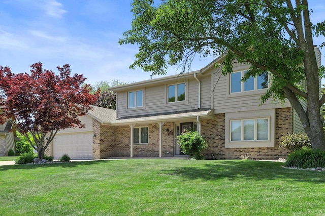 8206 41st Ave, Kenosha, WI 53142 - view of front of property featuring brick siding, a garage, and a front yard