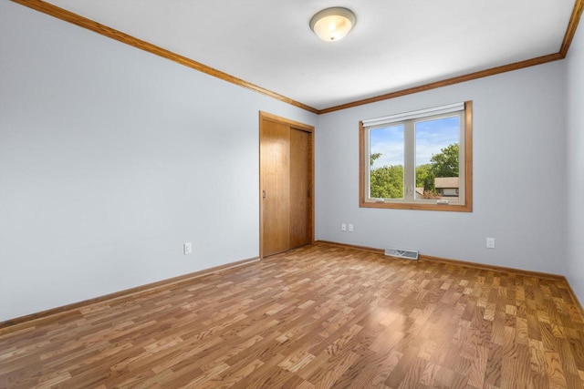8206 41st Ave, Kenosha, WI 53142 - empty room featuring crown molding and light wood-type flooring