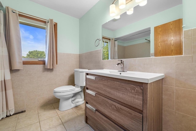 8206 41st Ave, Kenosha, WI 53142 - bathroom with tile walls, vanity, tile patterned flooring, and wainscoting