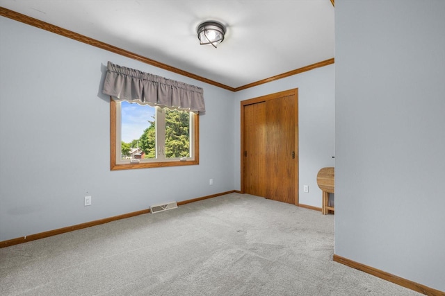 8206 41st Ave, Kenosha, WI 53142 - unfurnished bedroom featuring ornamental molding, carpet floors, and a closet