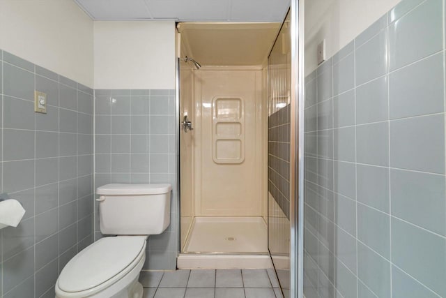 8206 41st Ave, Kenosha, WI 53142 - full bathroom featuring tile walls, a shower stall, and tile patterned flooring