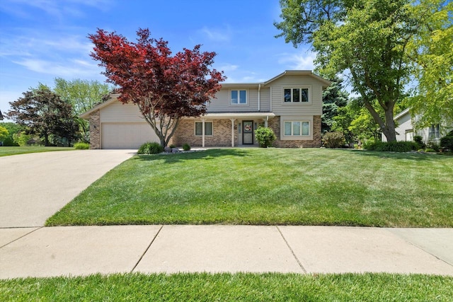 8206 41st Ave, Kenosha, WI 53142 - traditional home with an attached garage, driveway, brick siding, and a front lawn